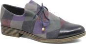Multicolored checkered shoe with a black toe cap on a white background