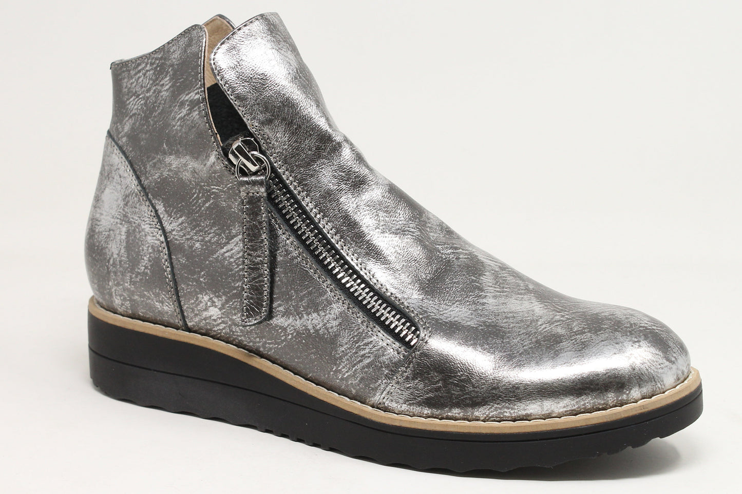 Silver wedge ankle boot on a white background