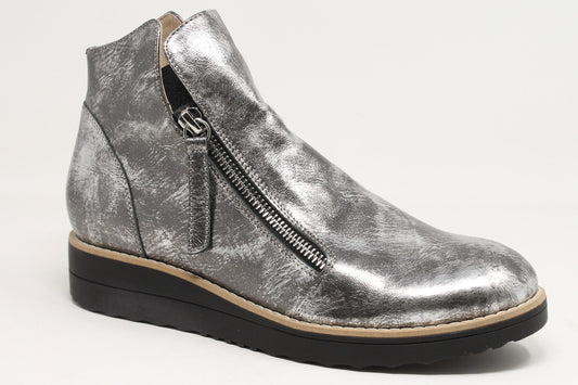 Silver wedge ankle boot on a white background