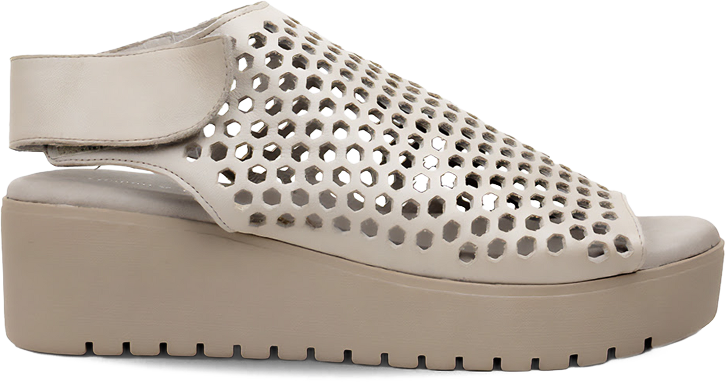 Beige perforated sandal on a white background