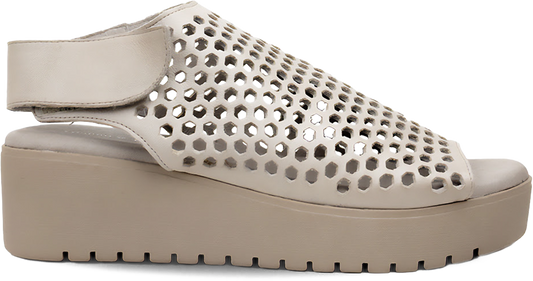 Beige perforated sandal on a white background