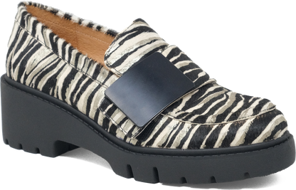 Loafer with zebra print pattern and black buckle on a white background