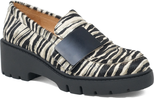Loafer with zebra print pattern and black buckle on a white background